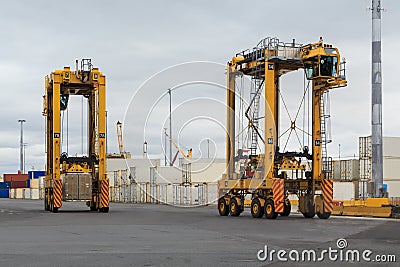 Straddle carriers in a busy port Stock Photo