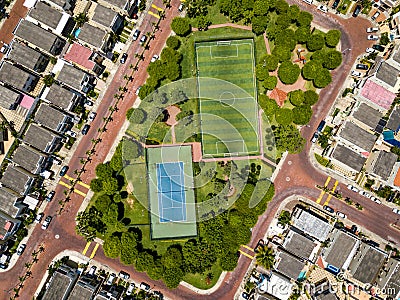 Straight down drone shot of empty mini soccer field and tenis court Stock Photo