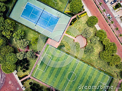 Straight down drone shot of empty mini soccer field and tenis court Stock Photo