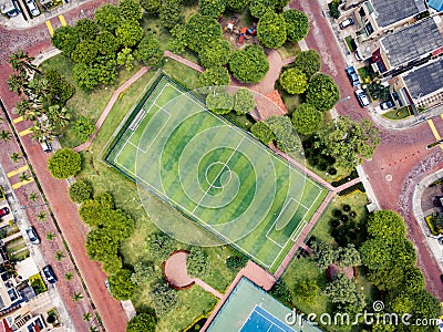 Straight down drone shot of empty mini soccer field and tenis court Stock Photo