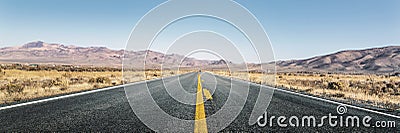 Straight highway in desert Stock Photo