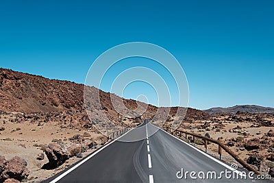 Straight highway road through desert, mountain landscape Stock Photo