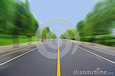 Straight road under blue sky Stock Photo