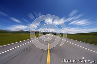 Straight road under blue sky Stock Photo