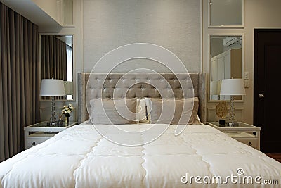 Straight shot of a large bed in a modern home Stock Photo