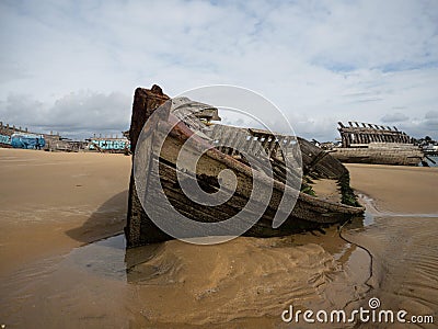 Stranded broken wooden shipwrecks on fishing boat naval graveyard marine cemetery in Magouer Etel river Brittany France Stock Photo