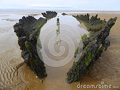 Stranded wreck of a wooden barque Stock Photo