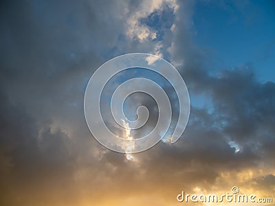 Strange clouds in the sky at sunset Stock Photo