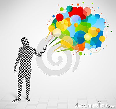 Strange guy in morphsuit looking at colorful speech bubbles Stock Photo