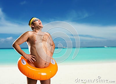 Strange naked man on the beach Stock Photo