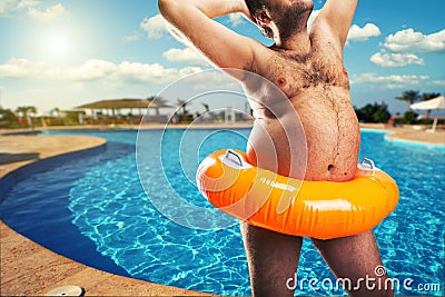 Strange naked man at the pool Stock Photo