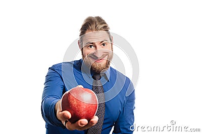 A strange office man with a big head offers an apple. transformed image. Stock Photo