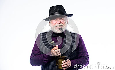 Strange people. Elegant bartender wear hat and vest prepare drink. Horror party. Frightening bartender. Weird old Stock Photo