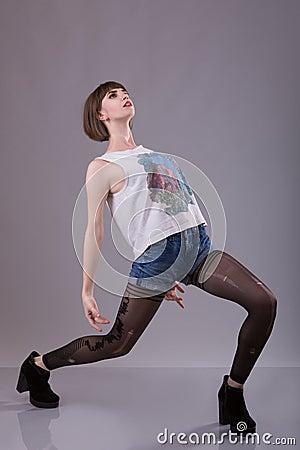 Strange woman sags back in torn pantyhose Stock Photo