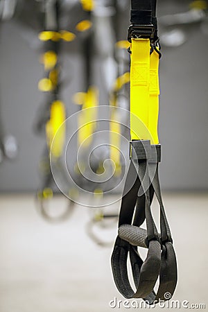 Straps training loop equipment. Black functional training equipment on grey background. Sport accessories. Fitness and Gym workout Stock Photo