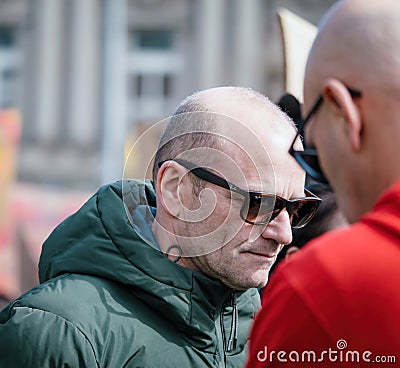 Adult wearing sunglasses at a protest in Strasbourg Editorial Stock Photo