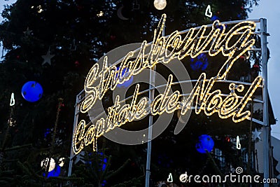 Illumined christmas decorations in the street, with text in french, Strasbourg capitale de noel, in english : Strasbourg the chris Editorial Stock Photo