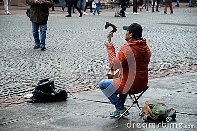 Portrait of musician playing traditional Mongolian violin in the street Editorial Stock Photo