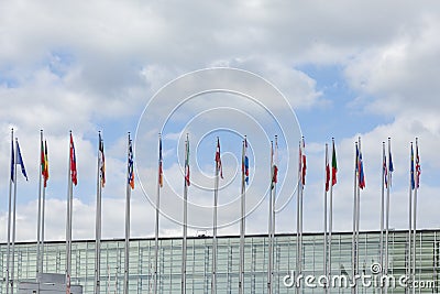 All EU Flags European Union flag waving in front of European Parliament, headquarter of the European Commission European Editorial Stock Photo
