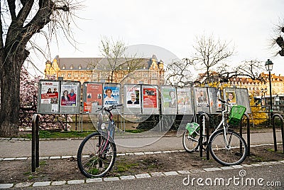 All candidate`s electoral campaign poster near polling station during first Editorial Stock Photo