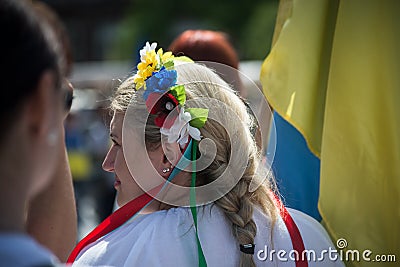 Woman with ukrainian flag anf flowers on head protesting against the war Editorial Stock Photo