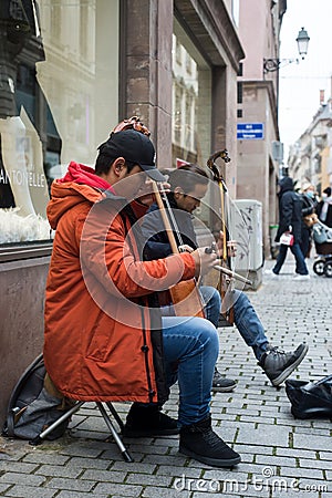 Musician playing traditional Mongolian violin in the street Editorial Stock Photo