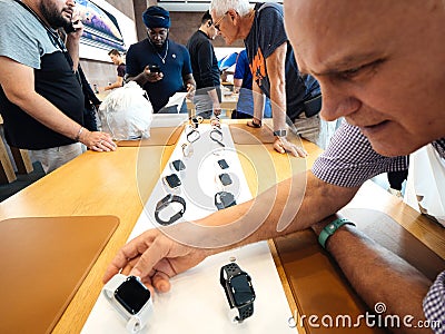 Adult senior man admiring latest Apple Watches Series 4 Editorial Stock Photo