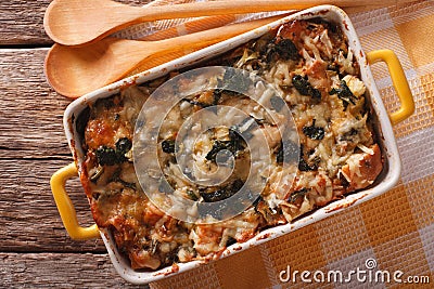 Strata casserole with spinach, cheese and bread close up. horizontal top view Stock Photo