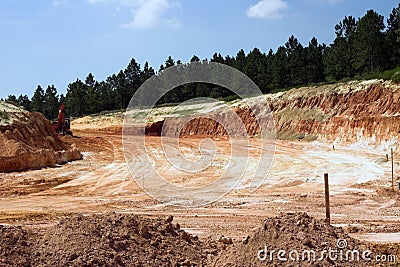 Strata of rock and dirt with trees Stock Photo