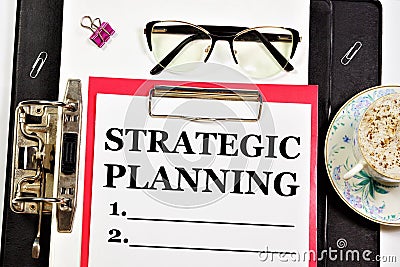 Strategic planning. A text label in a working notebook. Stock Photo