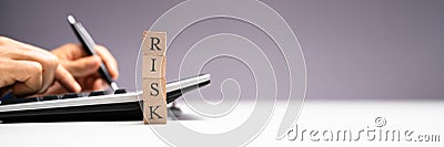 Strategic Risk Management Using Calculator Stock Photo