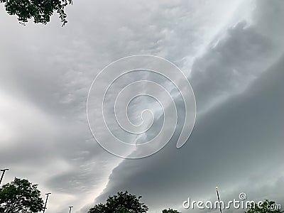 Stratus cloud cover over Chicagoland with breaks like craks in the clouds Stock Photo