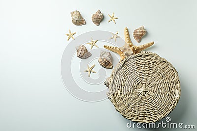 Straw bag and seashells on white background Stock Photo