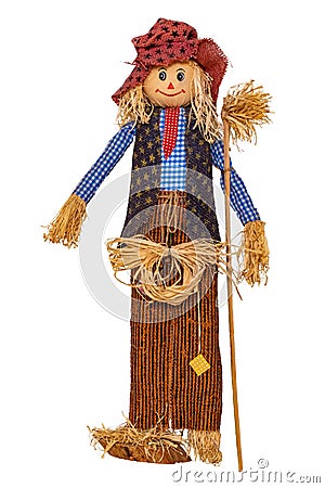 Straw decorations background. Close-up of a funny handmade scarecrow doll isolated on white background. Straw dolls for Stock Photo