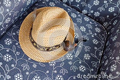 Straw Hat and Smoking Pipe Stock Photo