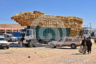 Straw hay bales truck in Morocco animal market Editorial Stock Photo