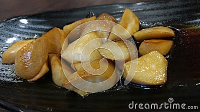 Straw mushroom fried with butter japanese menu Stock Photo