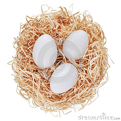 Straw nest filled with white eggs, top view isolated on white background. Happy Easter decorations, template for tag, gift Stock Photo