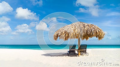 Straw umbrella on Eagle Beach, Aruba Stock Photo