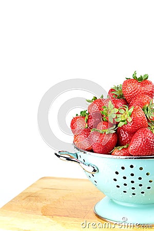 Strawberries in a blue colander Stock Photo