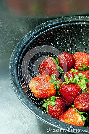 Strawberries in a colander Stock Photo