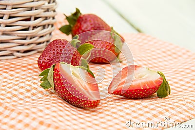 Strawberries lying on the orange napkin Stock Photo