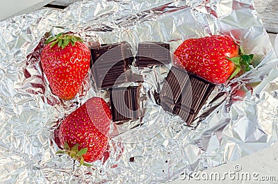 Strawberries with slices of chocolate Stock Photo