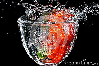 Strawberries splashed in water Stock Photo