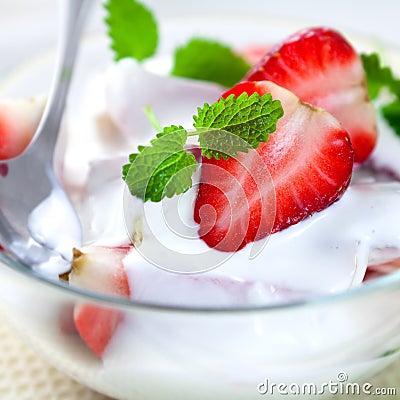 Strawberries with yogurt and lemon mint Stock Photo