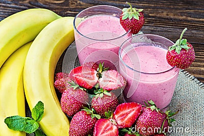 Strawberry and banana smoothie in the glass. Fresh strawberries Stock Photo