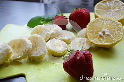 Strawberry and banana smoothie in the jar. Ingredients for making smoothies strawberry banana, frozen berries in a blender on a Stock Photo