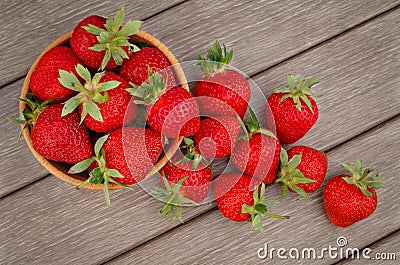 Strawberry in bowl on wooden Stock Photo