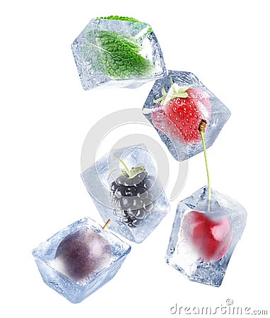 Strawberry, cherry, blackberry, passion fruit and mint frozen in ice cubes on white background Stock Photo