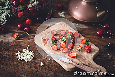 Strawberry and Cherry on Kitchen Table Stock Photo